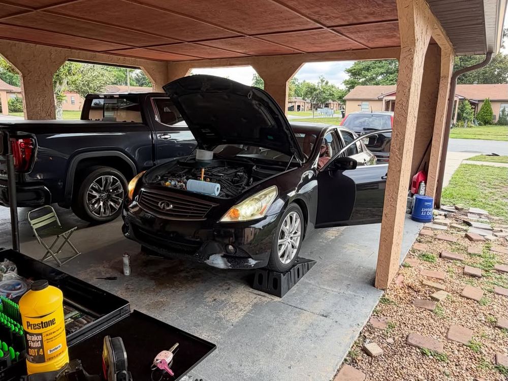 Hoods up under a carport, tools out, Bears Mobile Mechanic, Orlando FL
